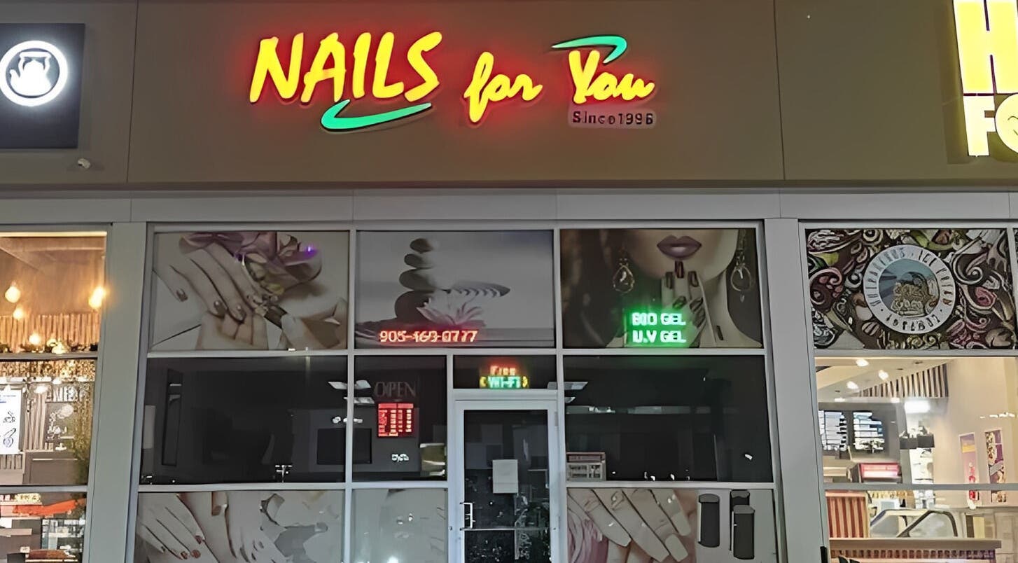 Front view of Nails For You salon in Brampton, Ontario, CA with vibrant signage and nail art posters.