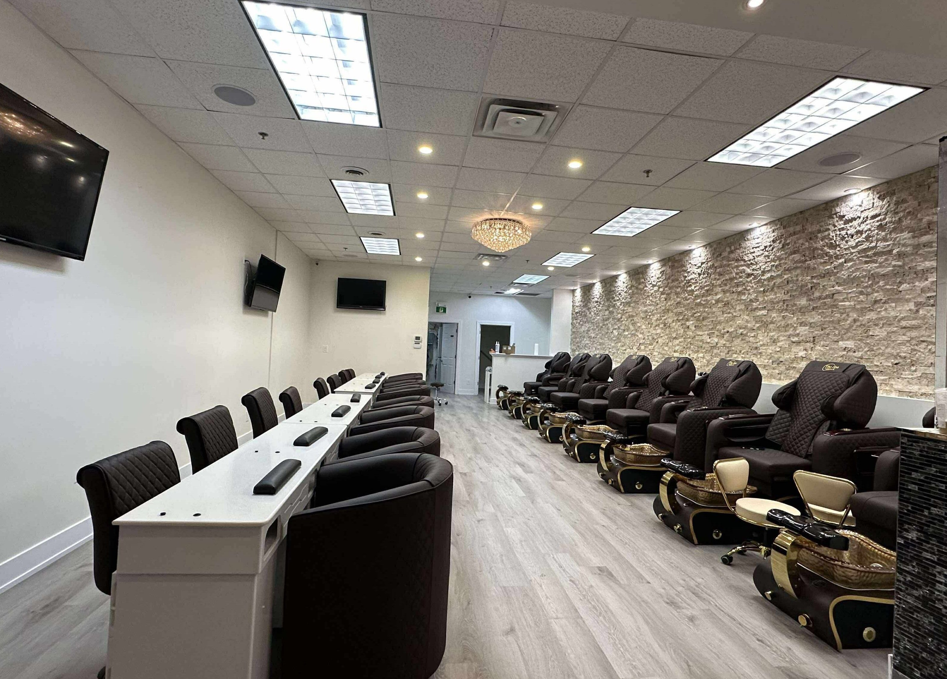 Elegant interior of Nails For You, Brampton, Ontario, CA with cozy pedicure chairs and stylish decor.