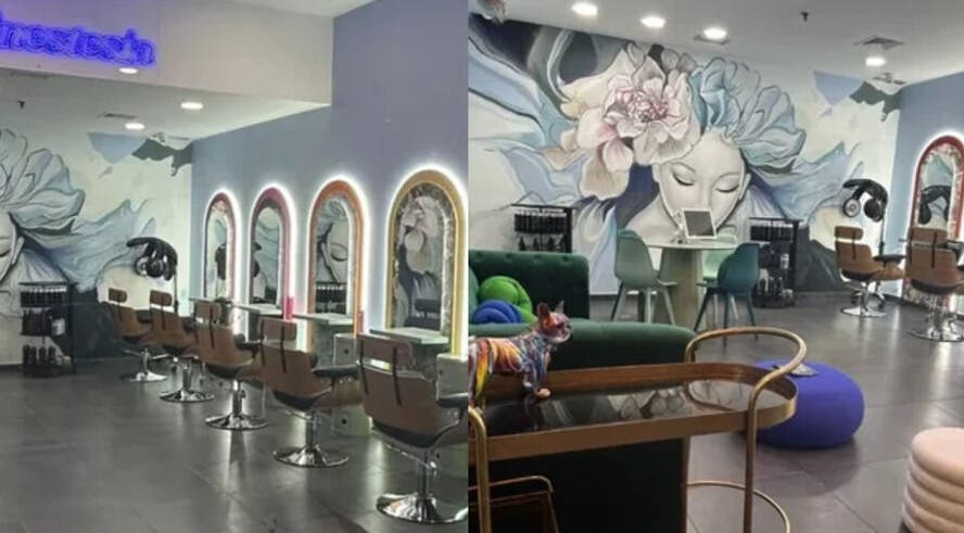 Interior elegante de Sinestesia Hair Experience en Collado Villalba, Comunidad De Madrid, ES con murales artísticos.