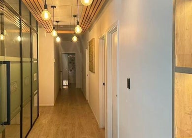 Warm-lit corridor at NM MEDSPA, Auckland, Auckland, NZ showcasing sleek modern design and inviting ambiance.