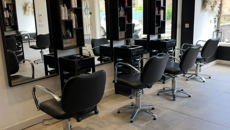 Interior of Hair By Kendal, Gourock, Scotland, GB, showcasing sleek styling chairs and mirrors in a modern salon.