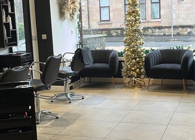 Cozy seating and festive decor at Hair By Kendal, Gourock, Scotland, GB.