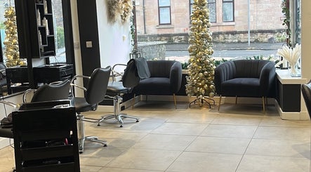 Cozy seating and festive decor at Hair By Kendal, Gourock, Scotland, GB.