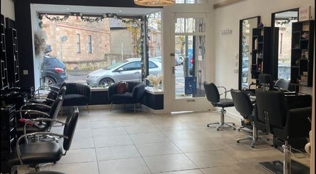 Modern salon interior at Hair By Kendal, Gourock, Scotland, GB showcasing chic chairs and elegant decor.