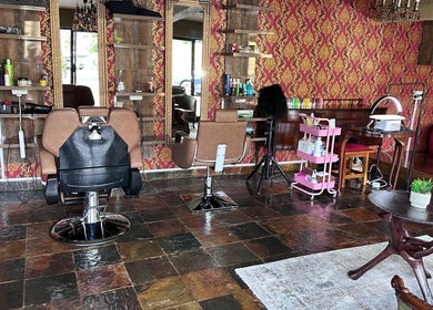 Elegant interior of GBL REINE CHATEAU BEAUTY BAR in Polokwane, Limpopo, ZA with stylish salon chairs and vibrant decor.