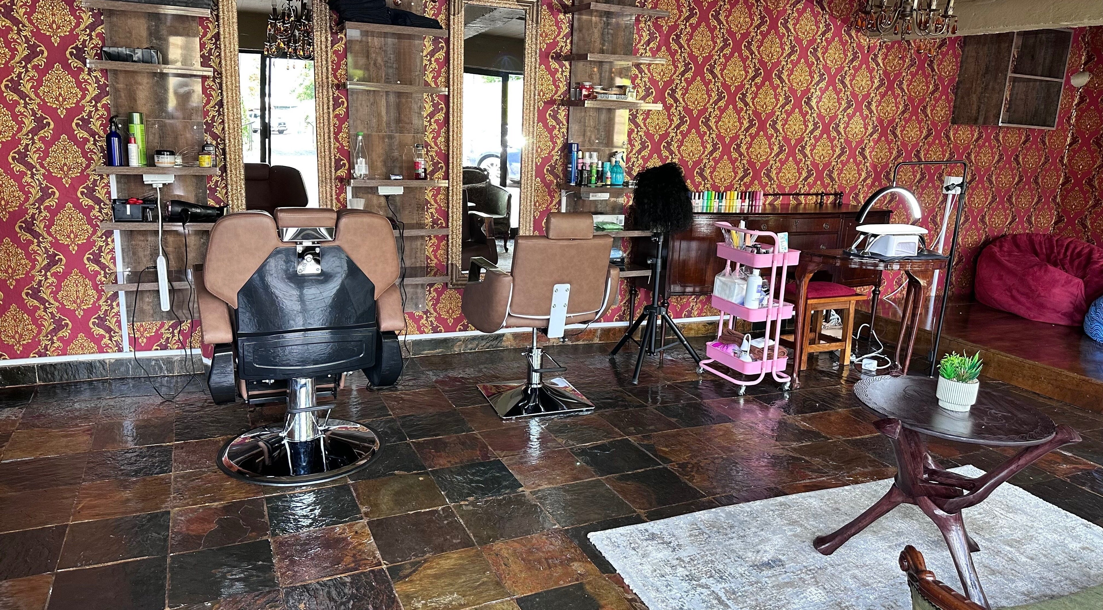 Elegant interior of GBL REINE CHATEAU BEAUTY BAR in Polokwane, Limpopo, ZA with stylish salon chairs and vibrant decor.