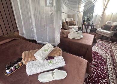 Luxury spa room at GBL REINE CHATEAU BEAUTY BAR, Polokwane, Limpopo, ZA, featuring plush decor and relaxation beds.