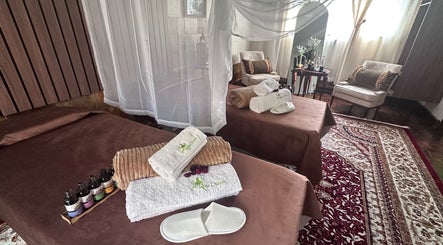 Luxury spa room at GBL REINE CHATEAU BEAUTY BAR, Polokwane, Limpopo, ZA, featuring plush decor and relaxation beds.