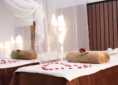 Relaxing massage tables at GBL REINE CHATEAU BEAUTY BAR, Polokwane, Limpopo, ZA, adorned with rose petals.