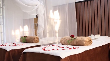 Relaxing massage tables at GBL REINE CHATEAU BEAUTY BAR, Polokwane, Limpopo, ZA, adorned with rose petals.