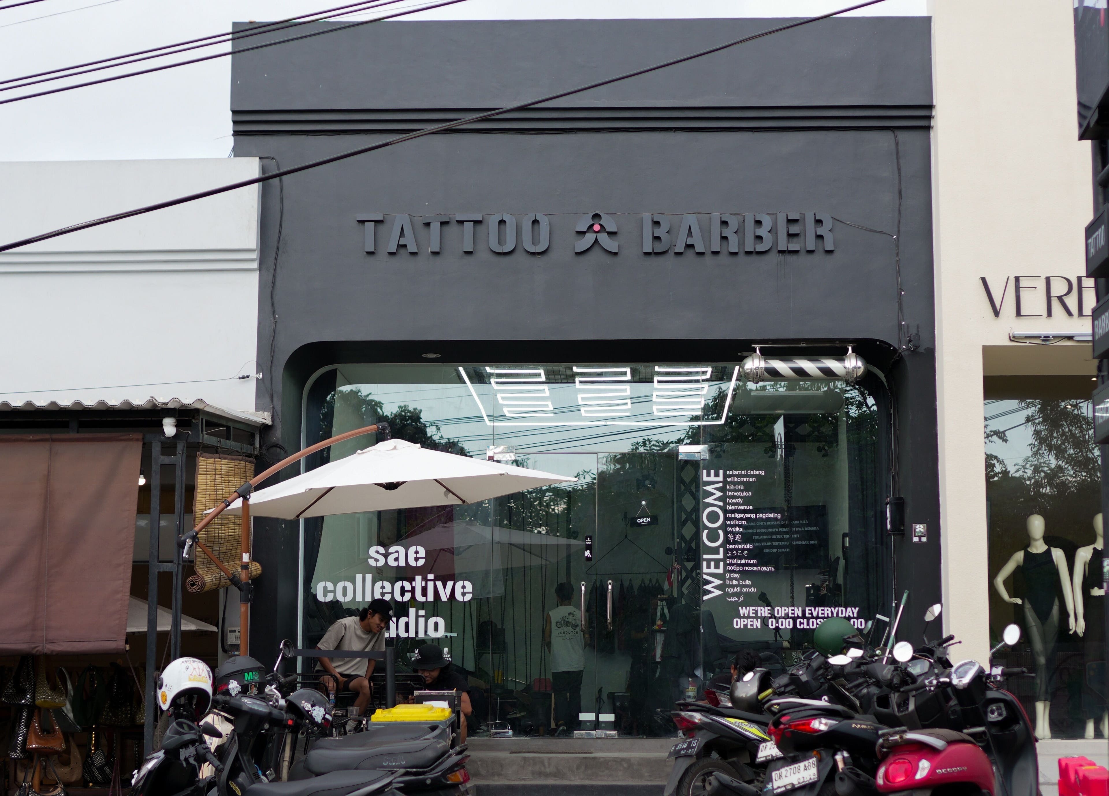 Front view of Sae Collective Barber in Bali, Bali, ID, showcasing sleek modern design with outdoor seating.