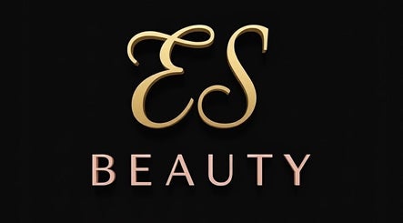 Sophisticated gold ES Beauty logo from Aberdare, Wales, GB on a dark background.