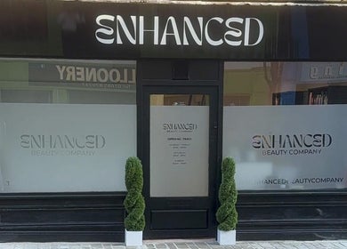 Front entrance of ES Beauty in Aberdare, Wales, GB with modern signage and decorative plants.