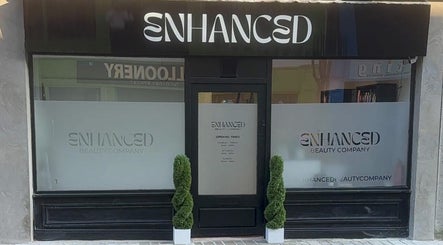 Front entrance of ES Beauty in Aberdare, Wales, GB with modern signage and decorative plants.
