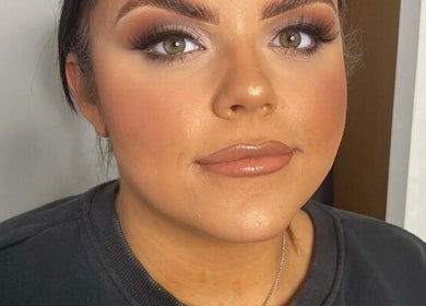 Close-up of a model with flawless makeup at ES Beauty, Aberdare, Wales, GB showcasing glamorous eye and lip style.