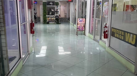 Bright hallway leading to Ariacrylics in Arima, Arima Borough Corporation, TT. Inviting and well-maintained space.