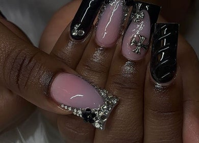 Chic black and pink nail art with embellishments at Rashelle Hair Nails and More, May Pen, Clarendon, JM.