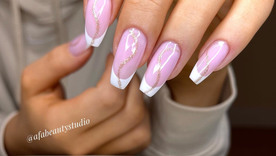 Elegant French manicure with glittery swirls at Afa Studio, Dublin, County Dublin, IE.