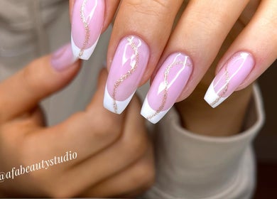 Elegant French manicure with glittery swirls at Afa Studio, Dublin, County Dublin, IE.