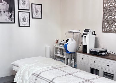 Modern treatment room at Solé Beauty Lounge, London, Ontario, CA with sleek equipment and cozy decor.