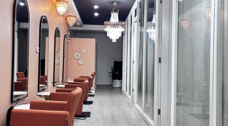 Elegant interior of Solé Beauty Lounge in London, Ontario, CA with chic seating and chandeliers.