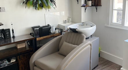 Elegant hair washing station at Na.Ko Hair London, London, England, GB, featuring comfortable seating.