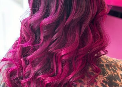 Vibrant pink curls styled at Reflectionz - Hair By Zoe, Raunds, England, GB.