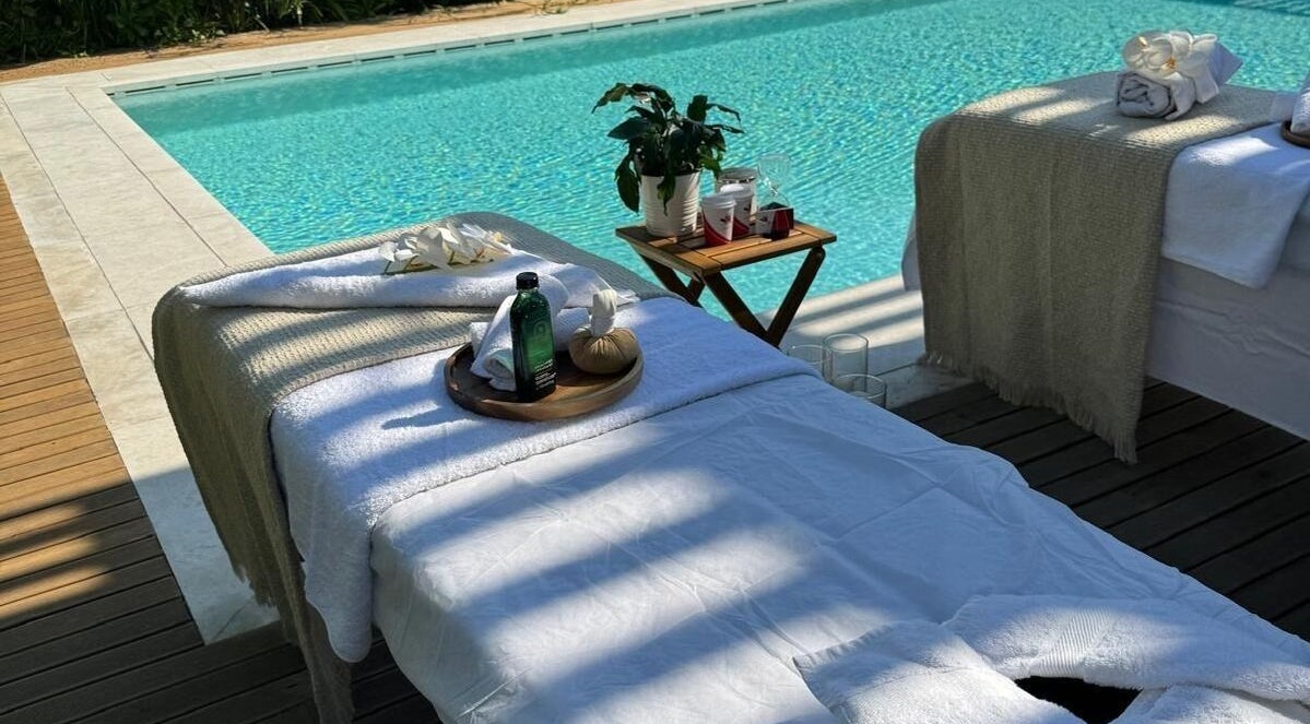 Relaxing poolside massage setup at Es Beauty Salon, Doha, Doha Municipality, QA.