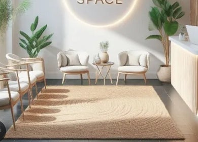 Elegant waiting area at Coco's Cosmetics, Poole, England, GB with cozy chairs and lush plants.