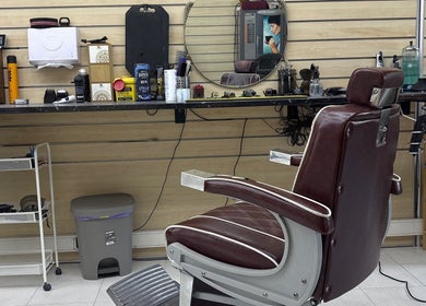 Cozy barber chair and tools at Prestígio, Ramada, Lisboa, PT, highlighting a classic grooming setup.