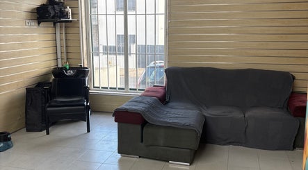 Comfortable seating and hair washing station at Prestígio, Ramada, Lisboa, PT, offering relaxation and style.