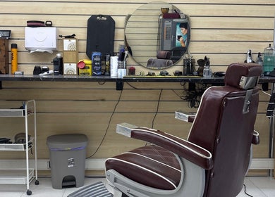 Barbershop setup at Prestígio in Ramada, Lisboa, PT. Leather chair and grooming tools evoke traditional charm.