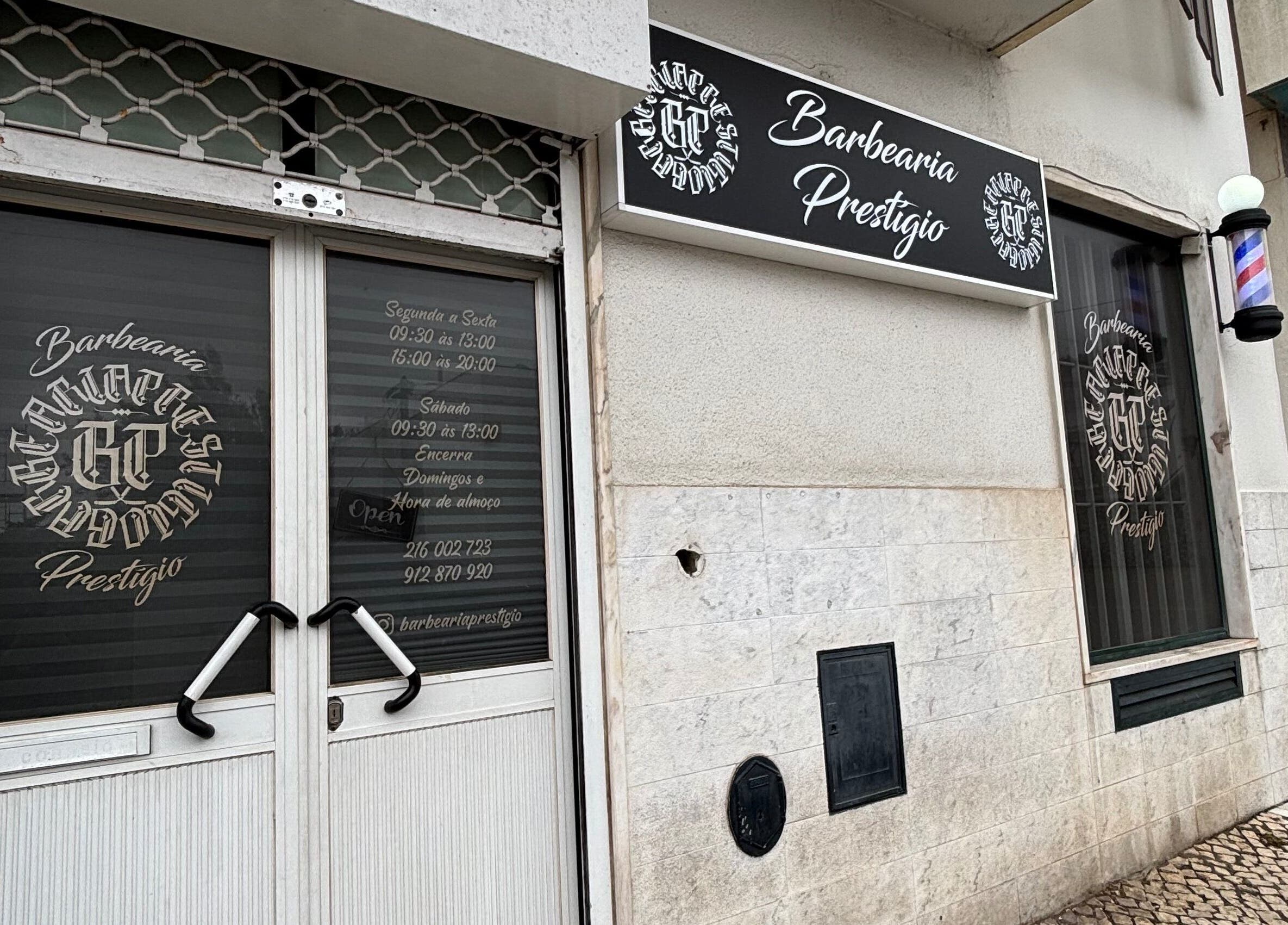 Entrance of Prestígio in Ramada, Lisboa, PT showing elegant signage and welcoming door.