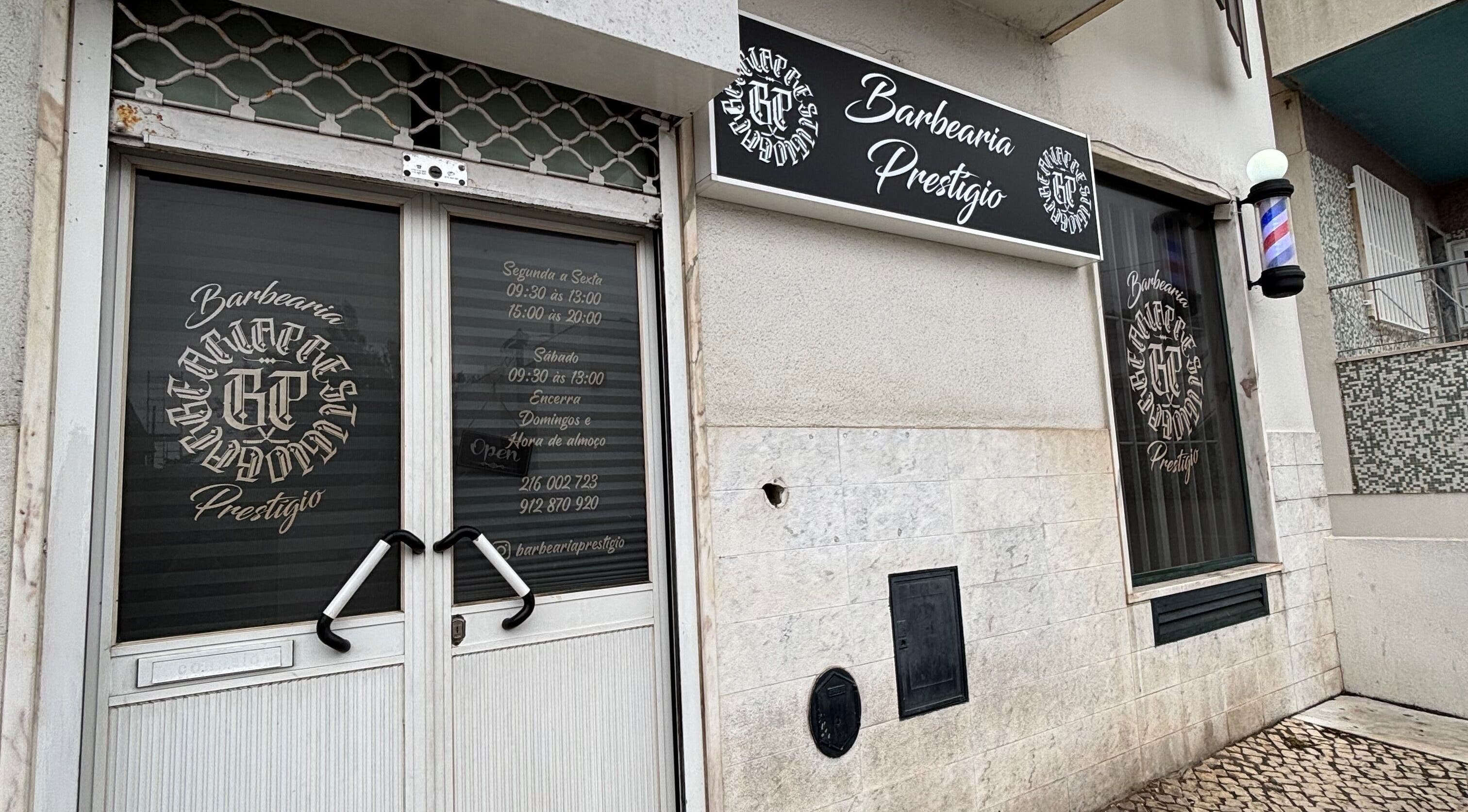 Entrance of Prestígio in Ramada, Lisboa, PT showing elegant signage and welcoming door.