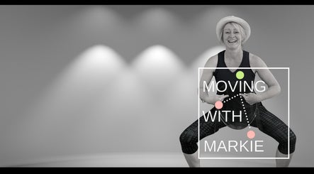 Smiling woman in exercise pose at Moving with Markie, Folkestone, England, GB.