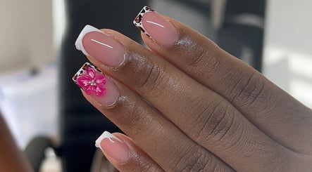 Elegant nail art with a pink floral design at TheNailLab, Belvedere, SX.