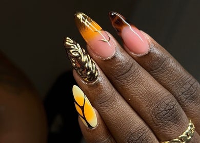 Intricate nail art design featuring gold embellishments at TheNailLab, Belvedere, SX.