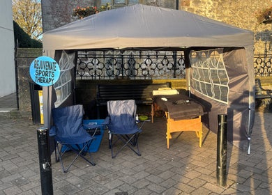 Outdoor therapy tent at Rejuvenate Sports Therapy, Milford Haven, Wales, GB, offers relaxing wellness services.