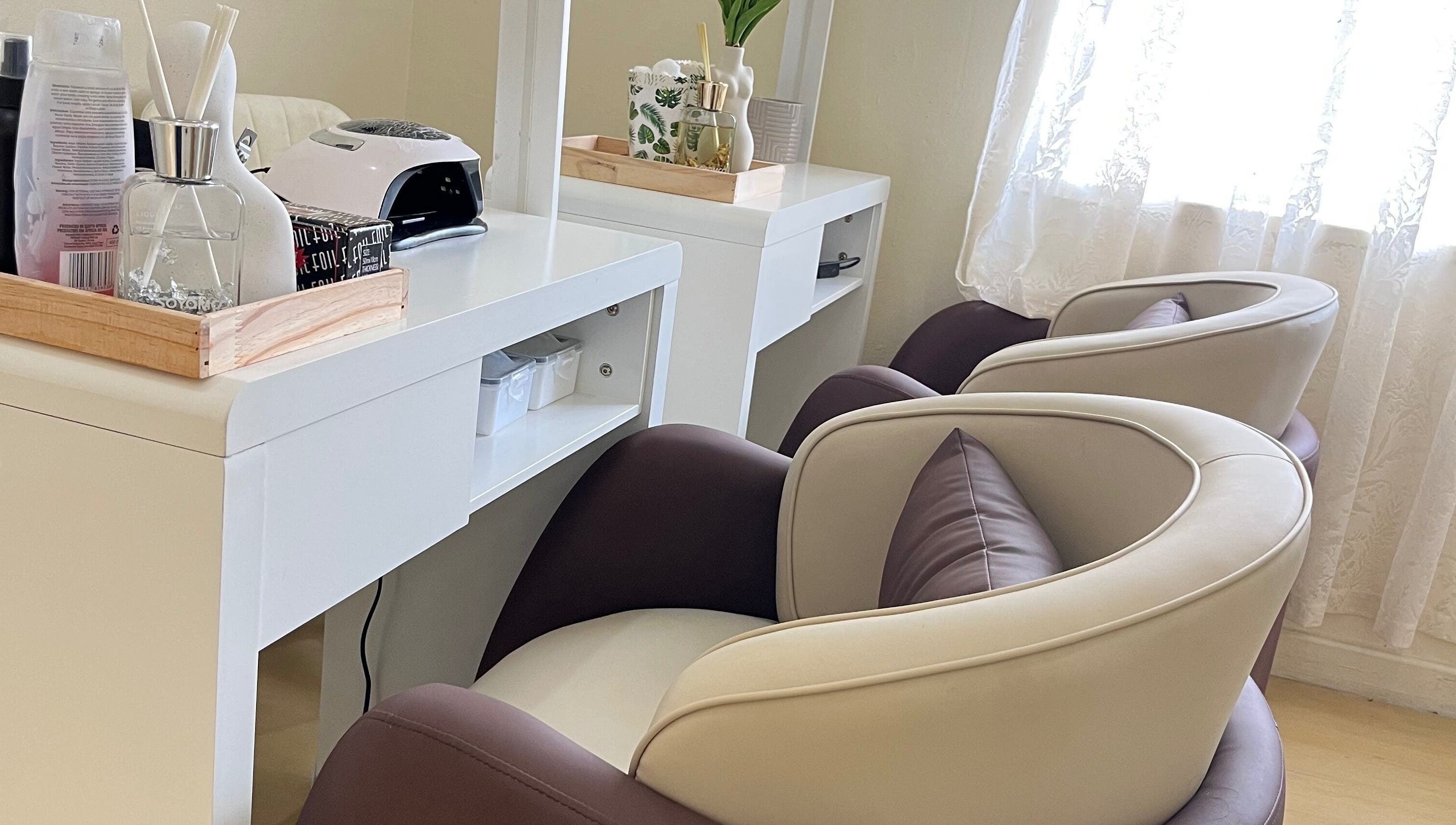 Elegant nail salon chairs at Essentials Lately, Harare, Harare Province, ZW offering premium relaxation.