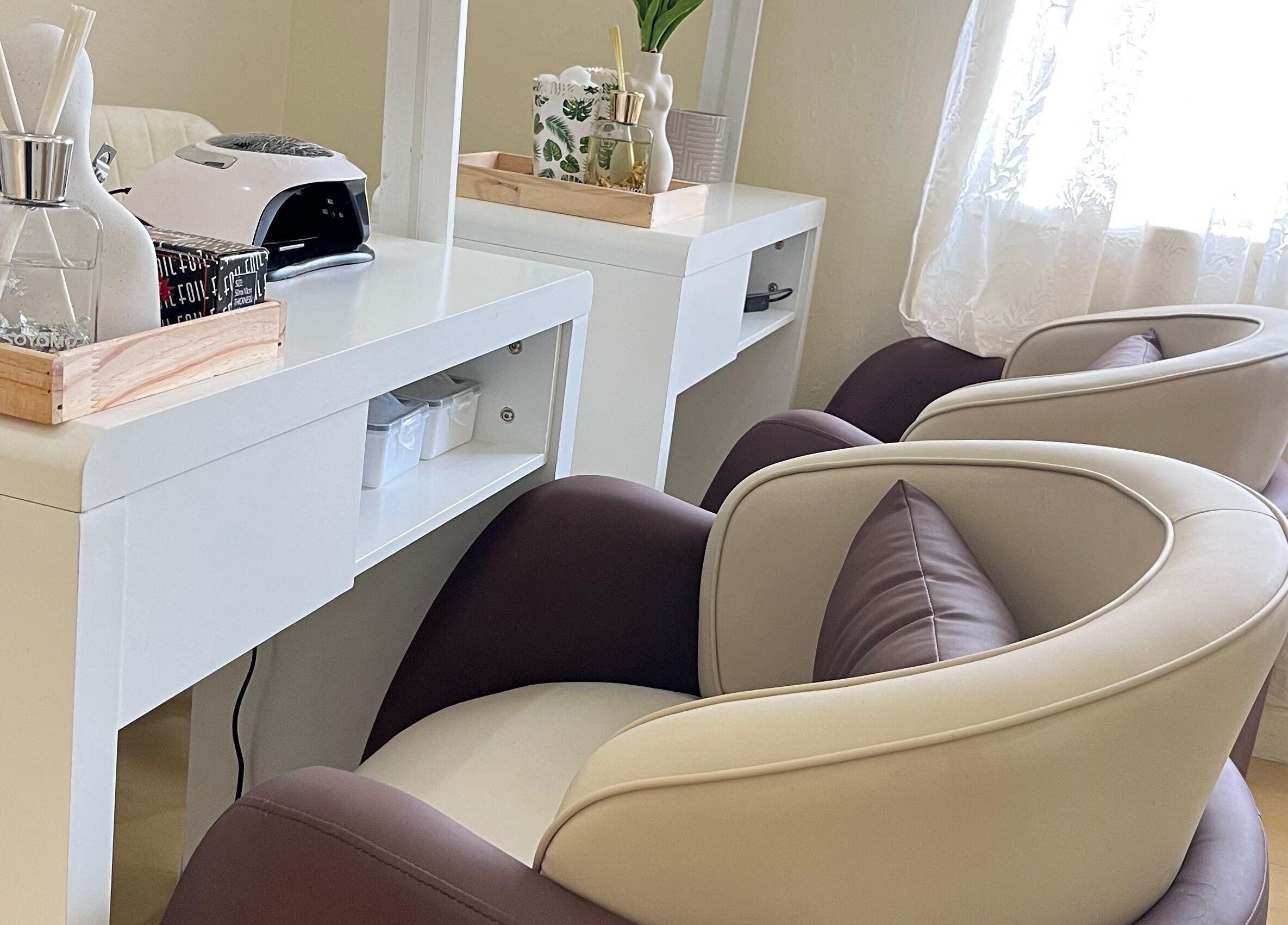 Elegant nail salon chairs at Essentials Lately, Harare, Harare Province, ZW offering premium relaxation.