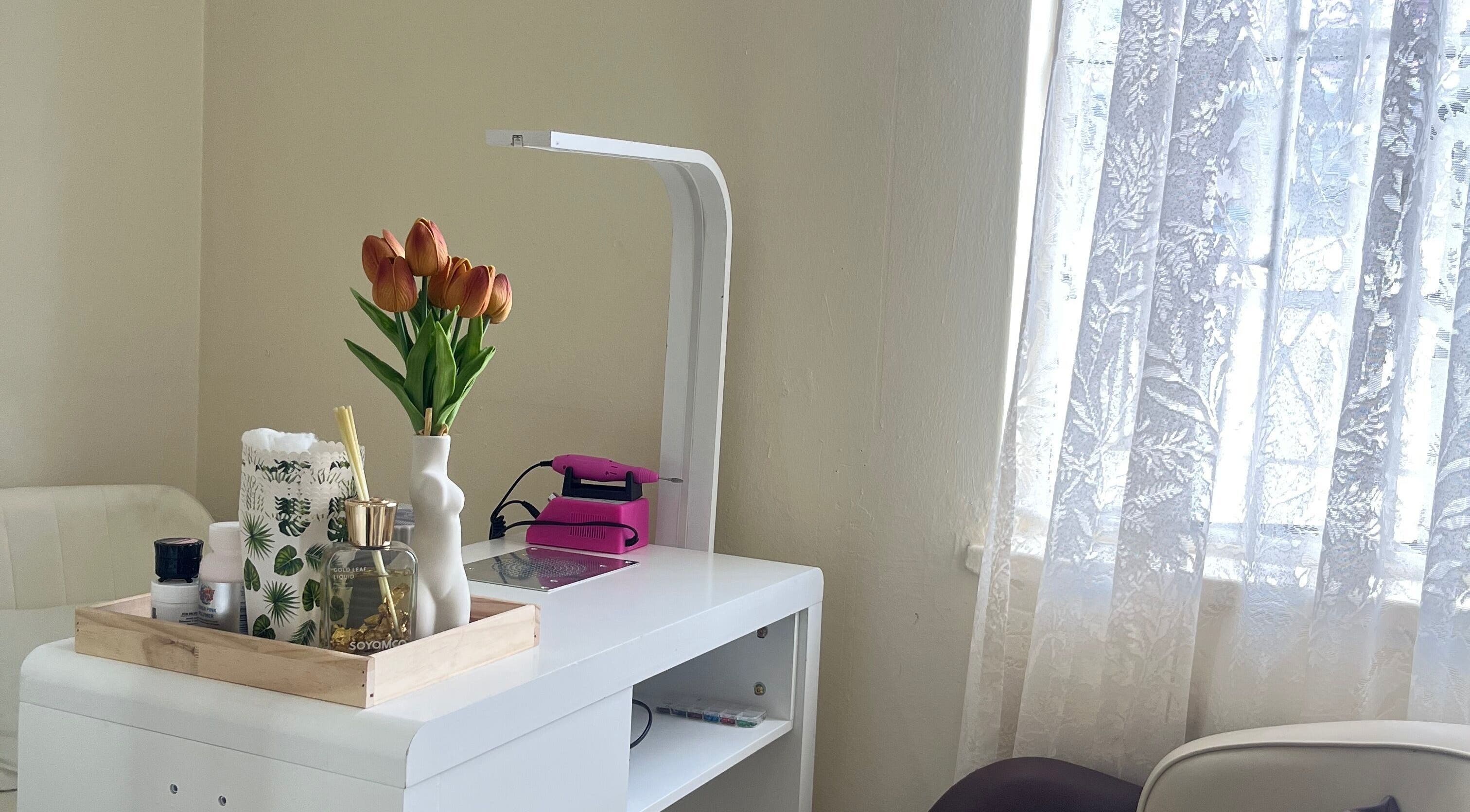 Elegant nail station with tulips at Essentials Lately, Harare, Harare Province, ZW.