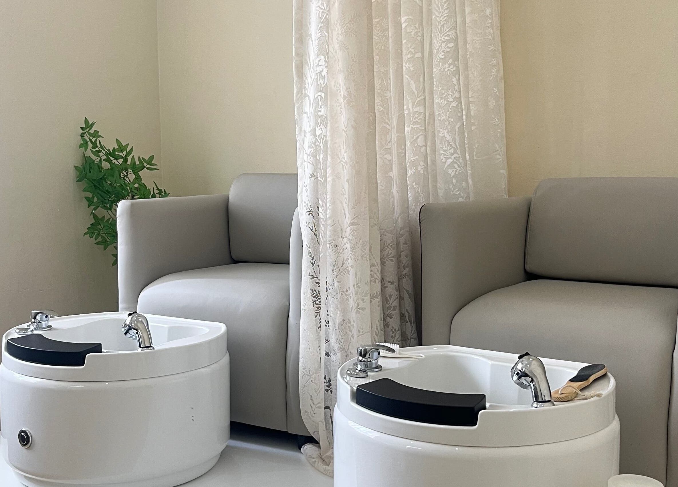 Relaxing pedicure chairs in elegant setting at Essentials Lately, Harare, Harare Province, ZW.