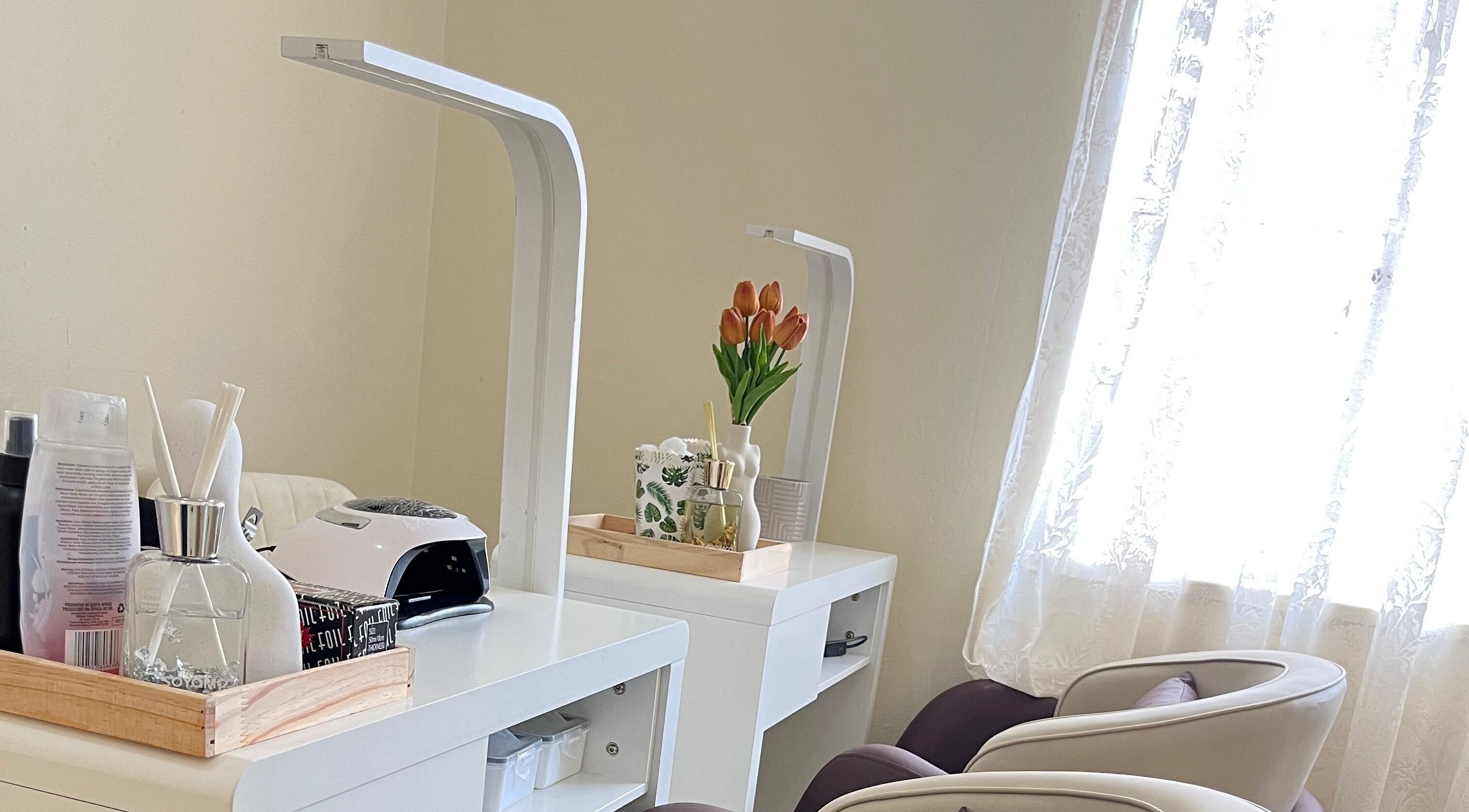 Essentials Lately nail salon setup in Harare, Harare Province, ZW with chairs and manicure station.