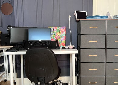 Elegant workspace at GLAMMY, London, England, GB featuring tech setup and storage.