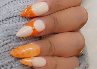 Elegant orange nail design at Sleek and Chic Glam Studio in Hull, England, GB.