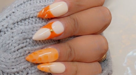 Elegant orange nail design at Sleek and Chic Glam Studio in Hull, England, GB.