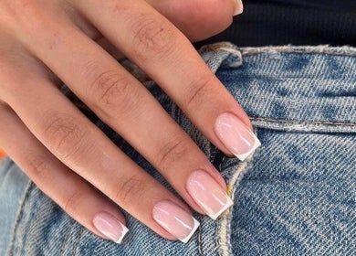 Elegant French tip nails at 24 Nails in Leeds, England, GB, showcasing modern style and precision.