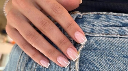 Elegant French tip nails at 24 Nails in Leeds, England, GB, showcasing modern style and precision.