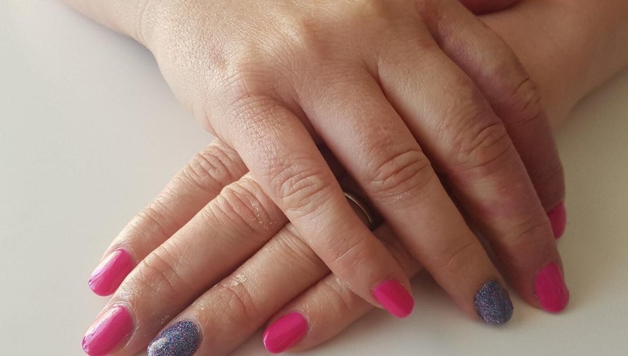 Vibrant pink and glitter nails manicure at Pampered Beauty Room, Cowdenbeath, Scotland, GB.