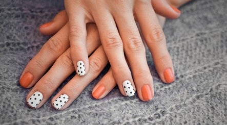 Stylish polka dot and coral nails at Pampered Beauty Room, Cowdenbeath, Scotland, GB.